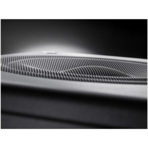 Neumann KH 750 studio subwoofer grille with circular mesh pattern, matte black finish, and refined texture against a dark backdrop.