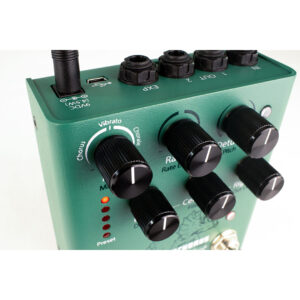 Eventide Tricerachorus green pedal with black rate, depth, pitch knobs, I/O jacks, USB port, and Vibrato/Chorus modes active.