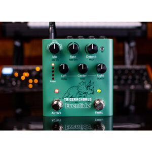 Eventide Tricerachorus green pedal features six black knobs, Active/Swirl footswitches, and a triceratops graphic on desk.