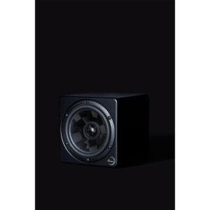 Black speaker with circular driver, softly left-lit, pairs perfectly with Prism Sound Titan in pro studio setups.