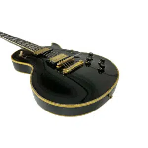 Preowned Gibson Custom 1957 Les Paul Reissue, SN 71228, gold hardware, black finish, four knobs; shown on white.