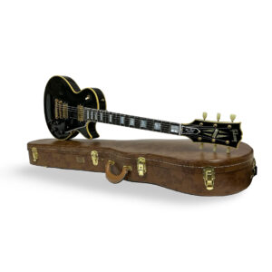 Preowned Gibson Custom 1957 Les Paul Reissue, gold hardware, white trim, on brown hard case with gold latches and handle.