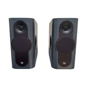 Preowned Kii THREE dark grey speakers (SN 3002/3003) with circular grilles, side ports, includes remote; upright pair.