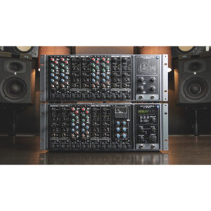 Cranborne 500ADAT black rackmount mixers with ADAT, knobs, meters on wood table in pro studio; speakers visible behind.