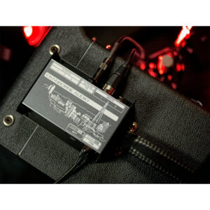 Cranborne Audio C.A.S.T. Intro Bundle with cables on textured black surface, accented by red light reflections.