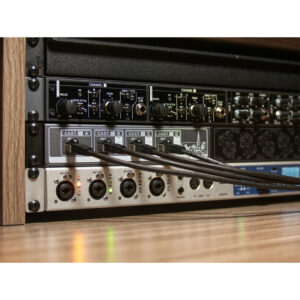 Cranborne C.A.S.T. Intro Bundle rack: silver panel, black knobs/cables, labeled I/O ports, in a wood frame.