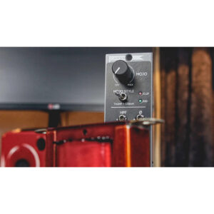 Cranborne Camden 500 Camden Mojo module: black knob, switches, indicator lights, red casing; blurred background.