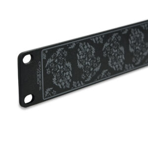 Cranborne Audio Half-Rack Kit black metal panel with floral design, two screw holes, and logo in the corner.
