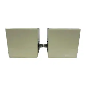 Avantone MixCube Passive speakers, square, glossy and light-colored, face each other with a metal hinge on white background.