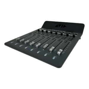Preowned Avid S1 black audio mixing control surface, 8 silver faders, AVID logo on tilted back panel, angled for detail.