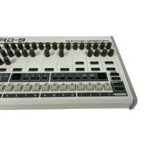 Behringer RD-9 Rhythm Designer drum machine, preowned, close-up of controls and labels, white background.