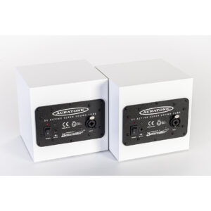White Auratone 5C Active speakers, side by side, display rear panels with "SC Active Super Sound Cube" label and controls.