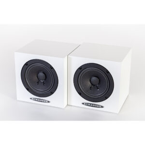 Auratone 5C Active white speakers, compact cube design, positioned side by side on a seamless white background.