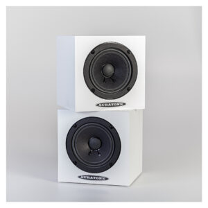 Auratone 5C Active White speakers, cube-shaped with black drivers, stacked on a light gray background.