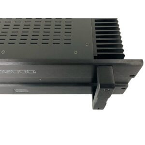 Bryston 4B SST Pro audio amplifier, SN 4BSST-002455, with ventilation holes, heat sink fins, and metal rack-mount bracket.