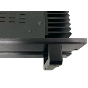 Bryston 7B SST Pro black mono amp, vented side panel, large heat sink, visible screws, preowned. White background.