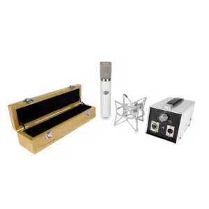 Monheim Creme tube condenser mic with metal shock mount, wooden case, and power supply on a white background.