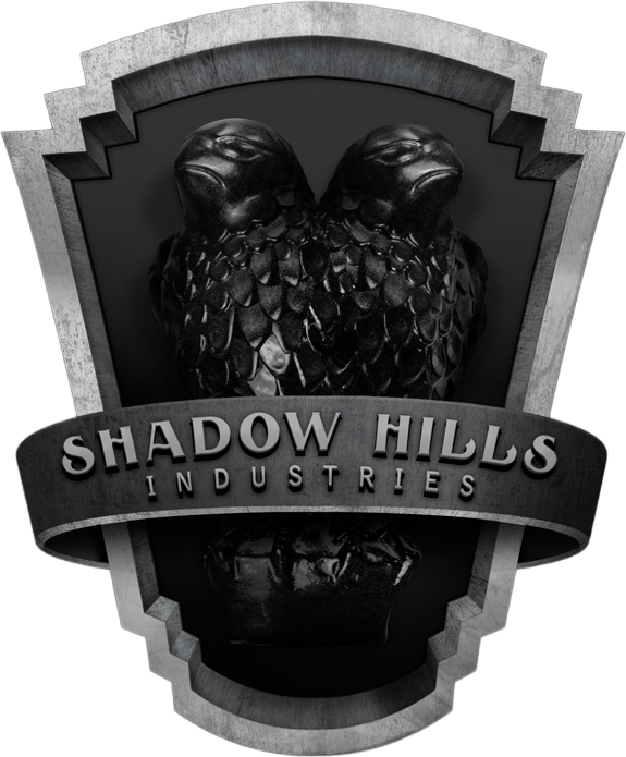 Shadow Hills Industries metallic shield logo with twin eagle heads, scales, and banner; monochrome design from Mastering Compressor.